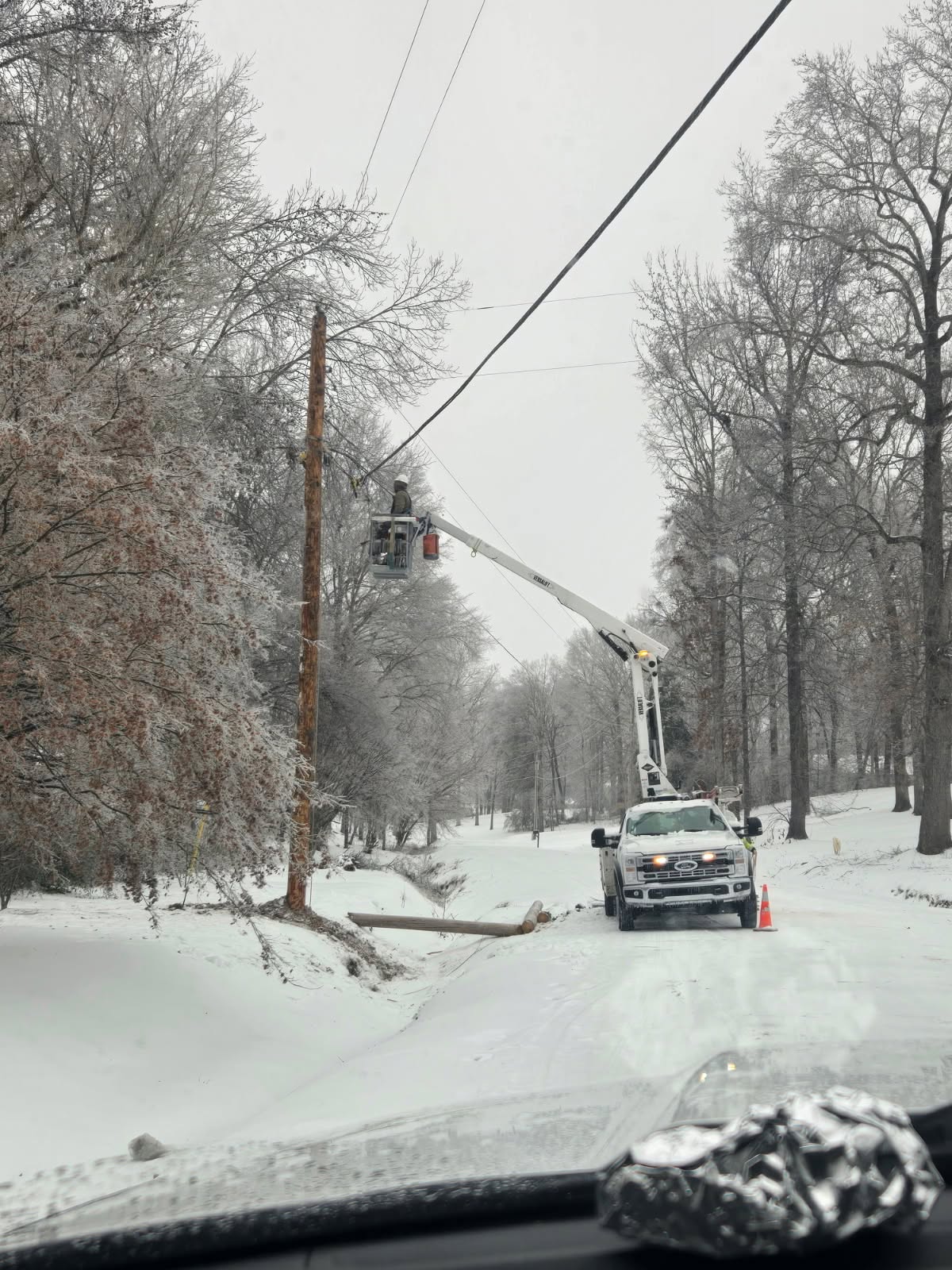 BOI bucket truck crew working in winter conditions