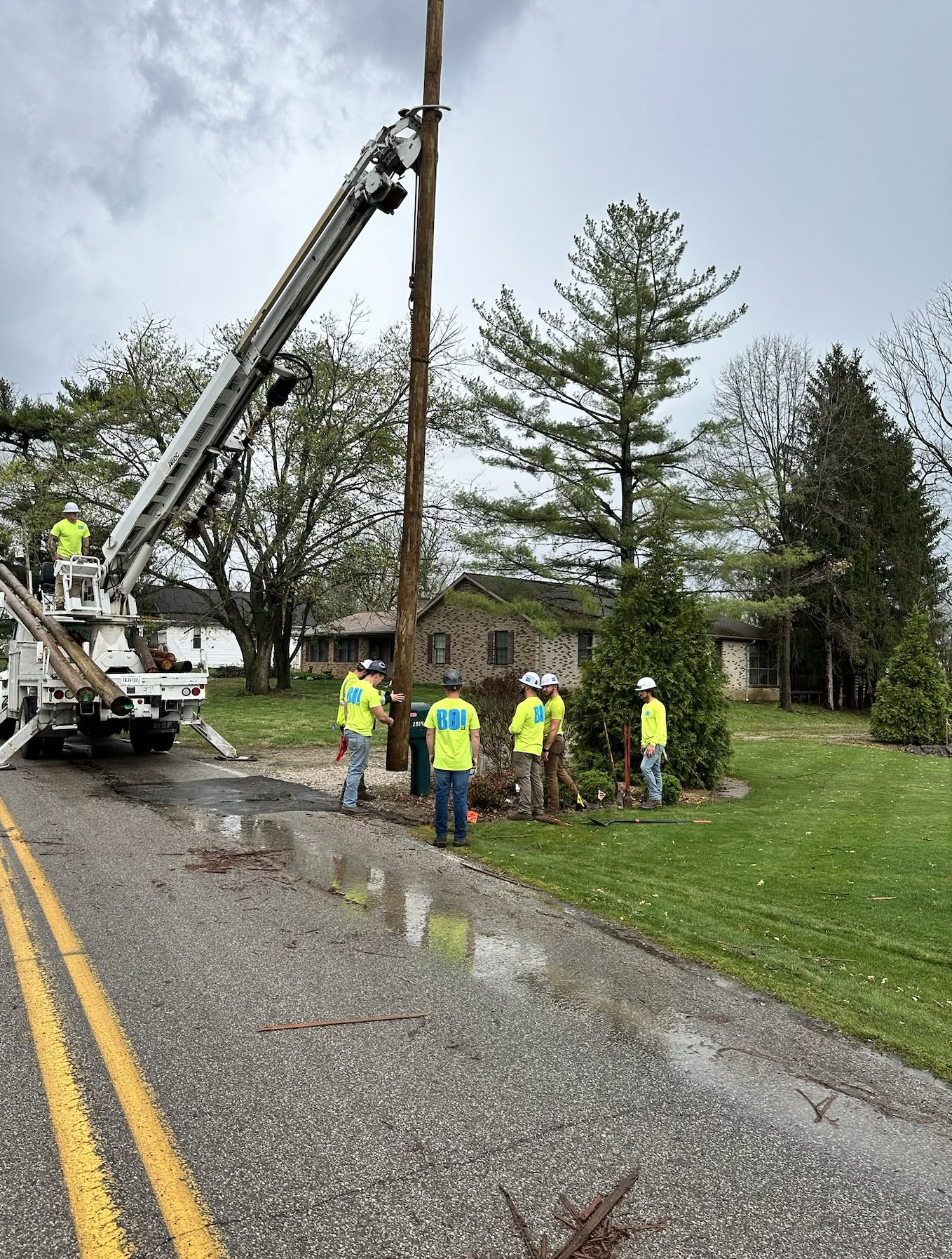 BOI crew setting a Class 3 utility pole on an aerial build